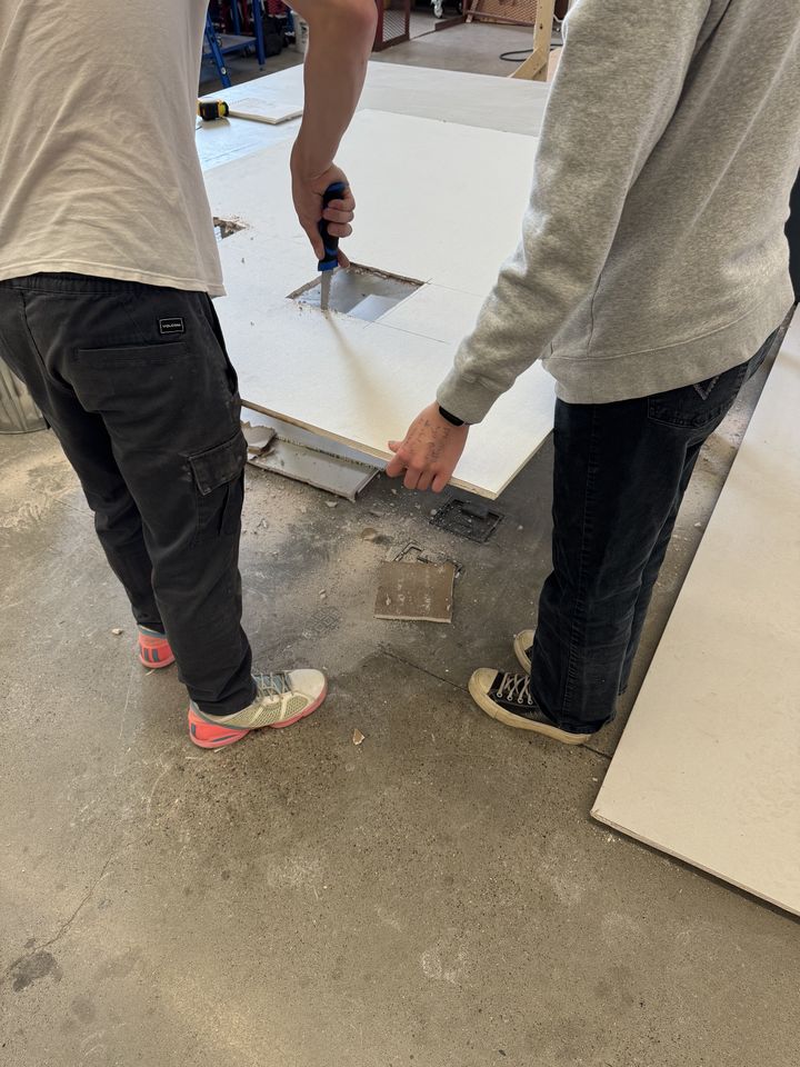 Drywall: students working on drywall