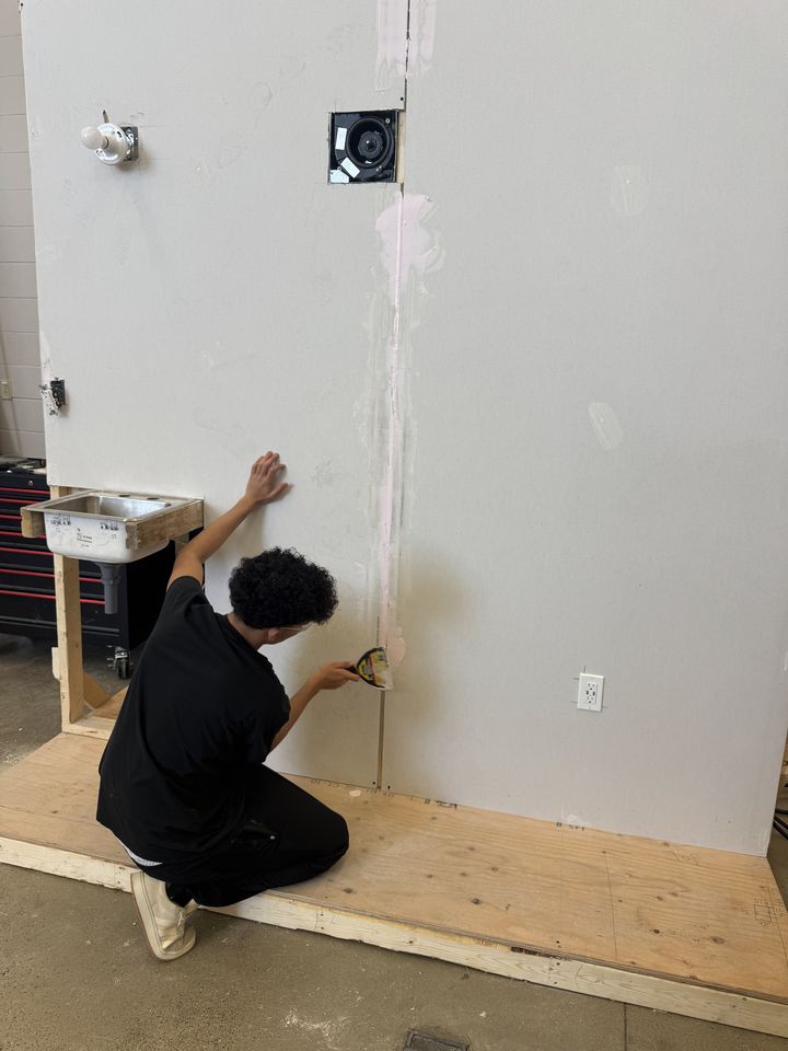 Drywall: students working on drywall