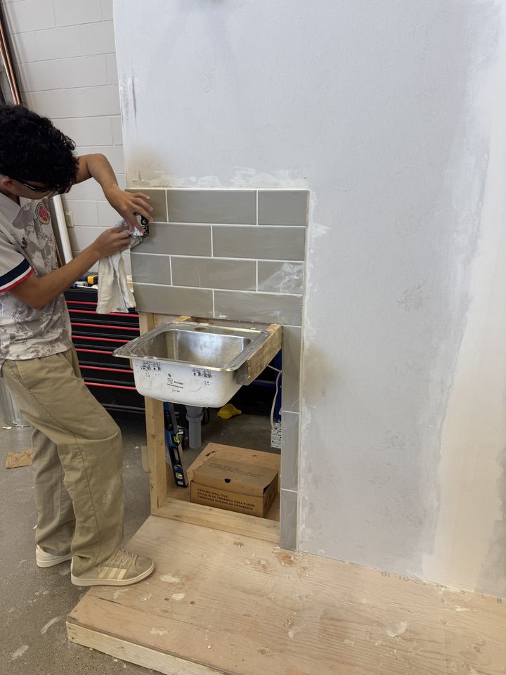 Drywall: students working on drywall