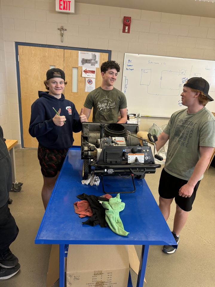 Small-Engine Repair: students working on a small engine