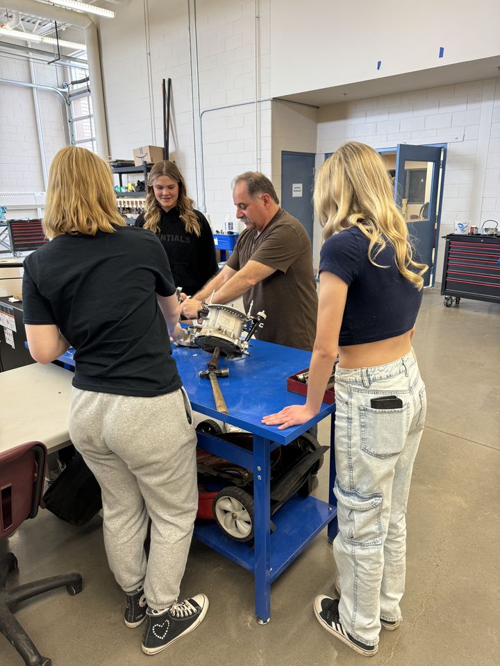 Small-Engine Repair: students working on a small engine