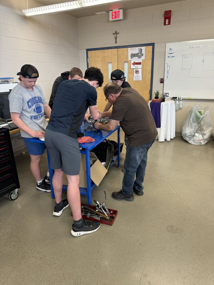 Small-Engine Repair: students working on a small engine
