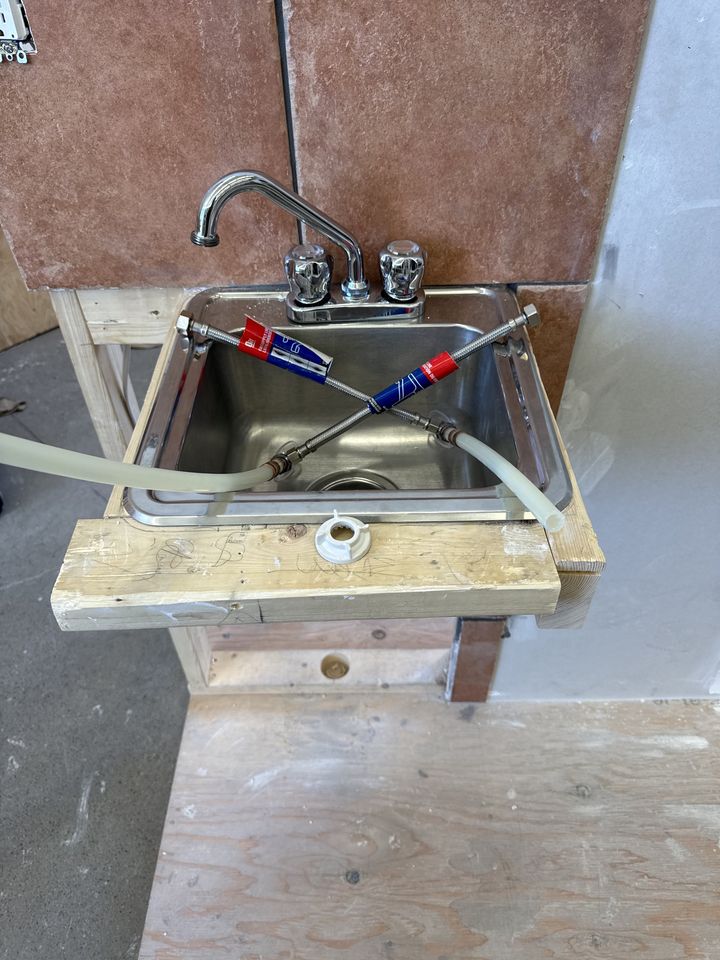 Plumbing: students working on plumbing