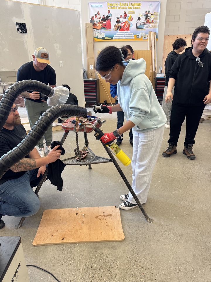 Plumbing: students working on plumbing